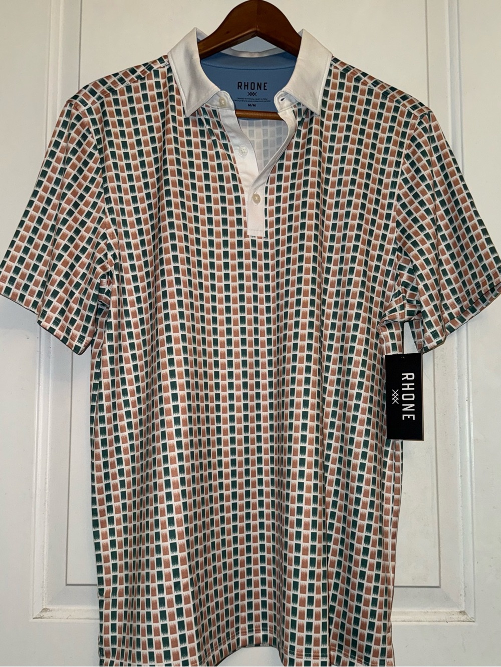 Rhone NWT Delta Pique Performance Polo in Terracotta and Teal Geometric Print